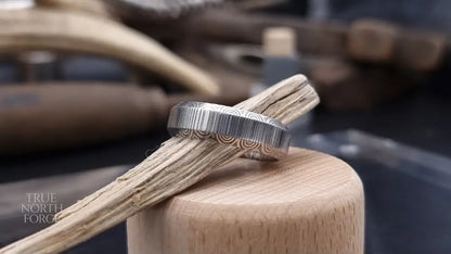 Unique handcrafted Damascus steel ring with bevelled edges