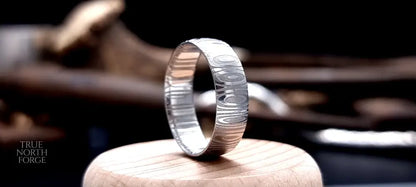 Unique men’s wedding ring in Cowie patterned Damascus steel