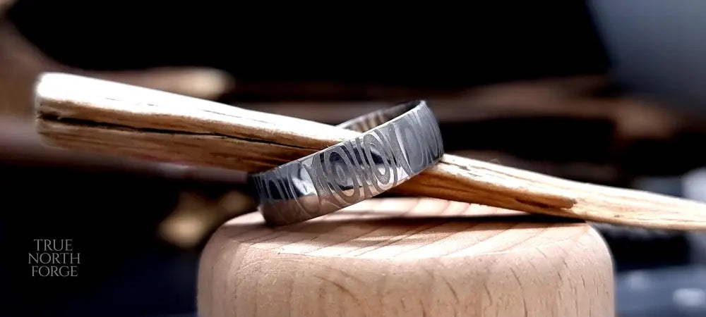 Unique men’s wedding ring in Cowie patterned Damascus steel