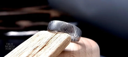 Unique men’s wedding ring in Cowie patterned Damascus steel