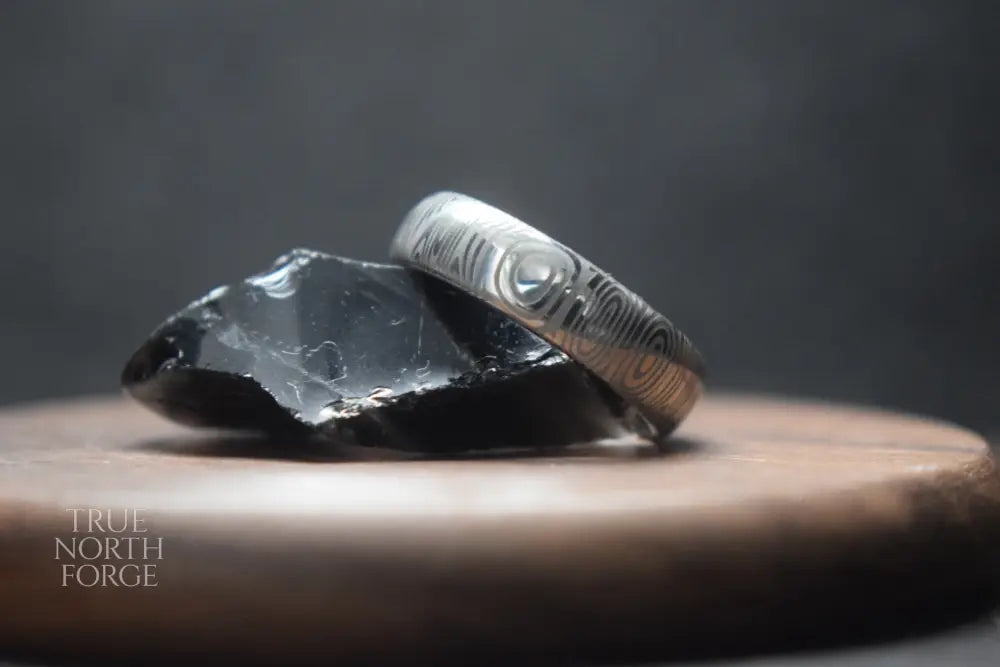 Damascus Steel Ring with Black Zirconium Liner - True North Forge