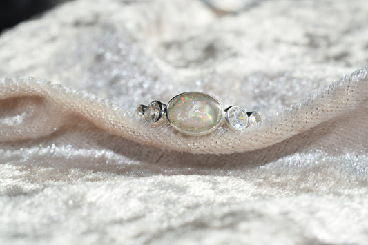 Oval silver memorial ring with CZ accents and cremation ashes setting