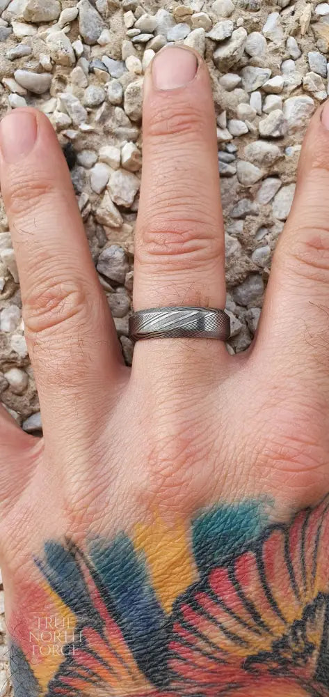 Unique men’s Damascus steel ring featuring Esk patterned layers