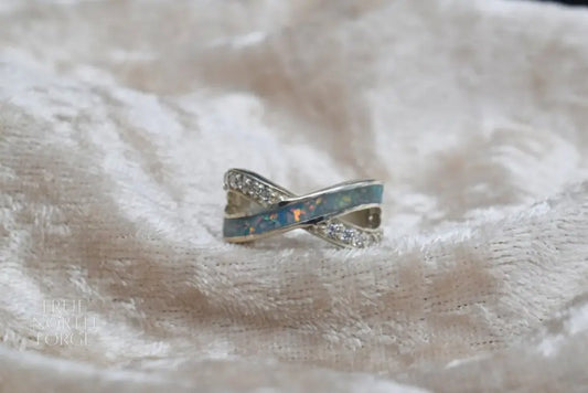 Sterling silver memorial ring with half-entwined CZ detail and hidden ashes