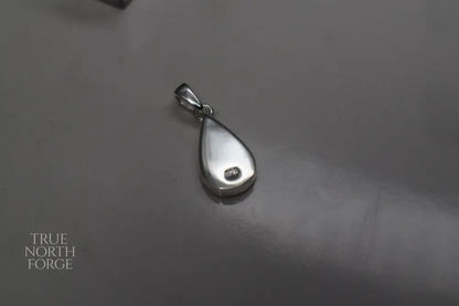 Handmade teardrop silver memorial ashes necklace with discreet ashes inlay, crafted in the UK