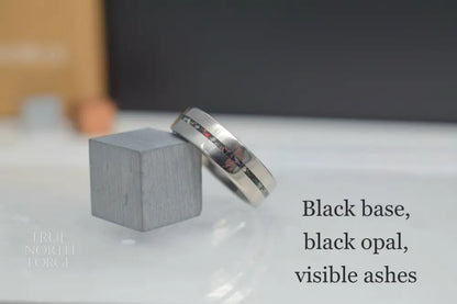 Titanium memorial ring with single resin-filled channel for cremation ashes